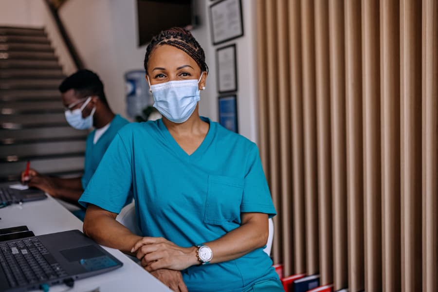 Medical assistant in face mask 