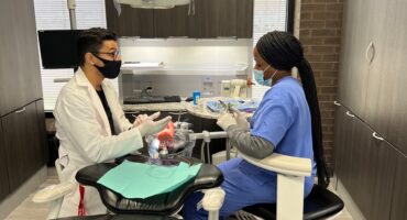 dental instructor with student in dental lab